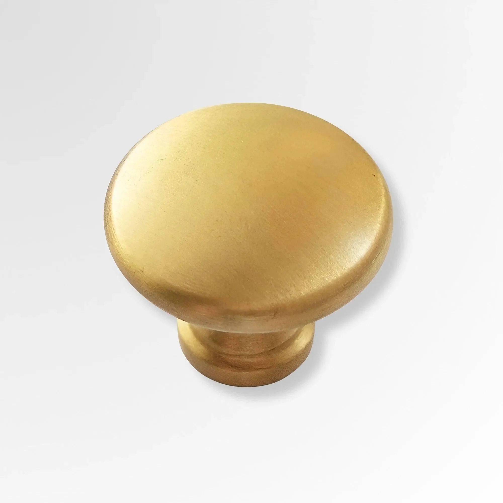 Minimalist Round Brass Knobs for Sleek Kitchen Cabinet Design