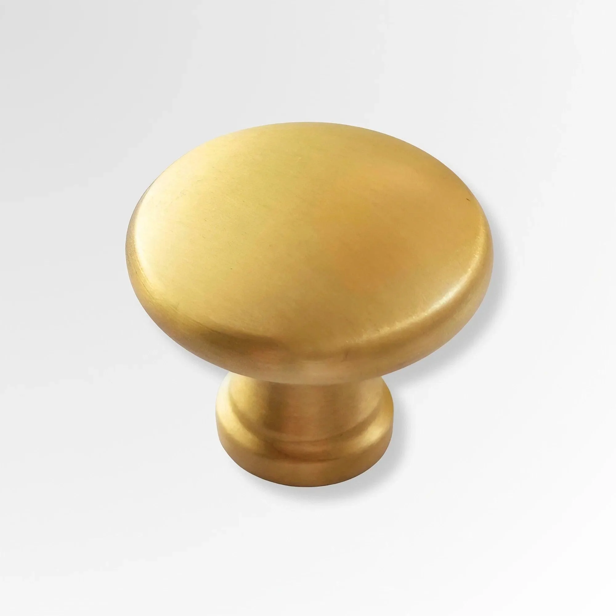 Minimalist Round Brass Knobs for Sleek Kitchen Cabinet Design